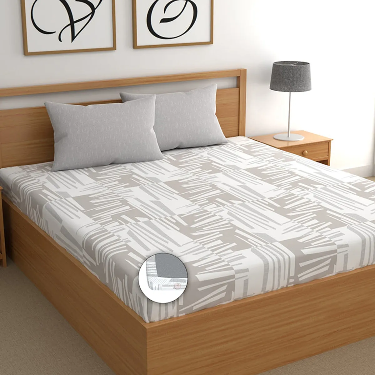Grey and white abstract fitted bedsheet on a wooden bed with corner detail inset