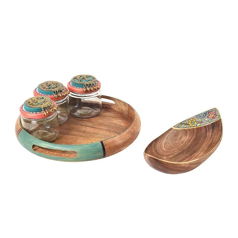 Three glass jars, a round wooden tray and a separate curved wooden platter shown together.
