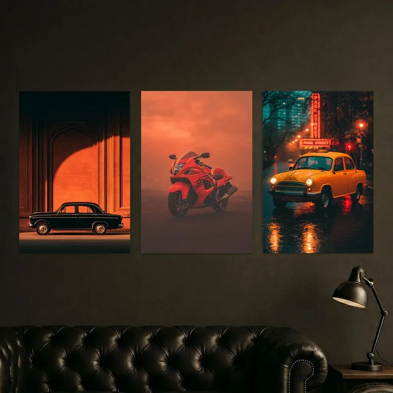 Three car-themed posters displayed above a dark sofa with a floor lamp