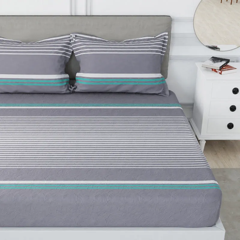 Close view of grey bedsheet with fine white stripes and teal accent bands