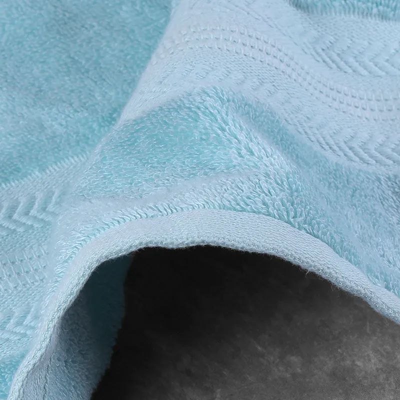 Close-up of a soft blue textured bath towel with a folded edge