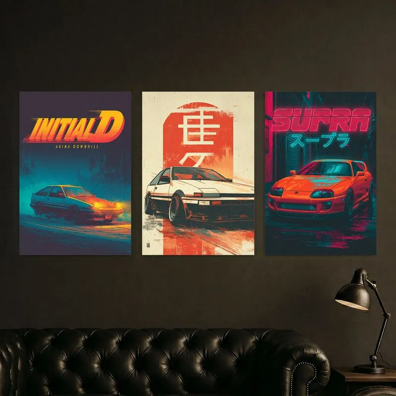 Three multicolour automotive posters arranged above a dark sofa