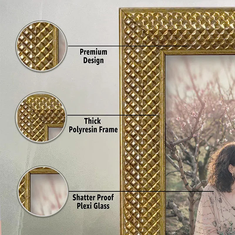 Close-up of a gold textured photo frame border and clear photo panel.