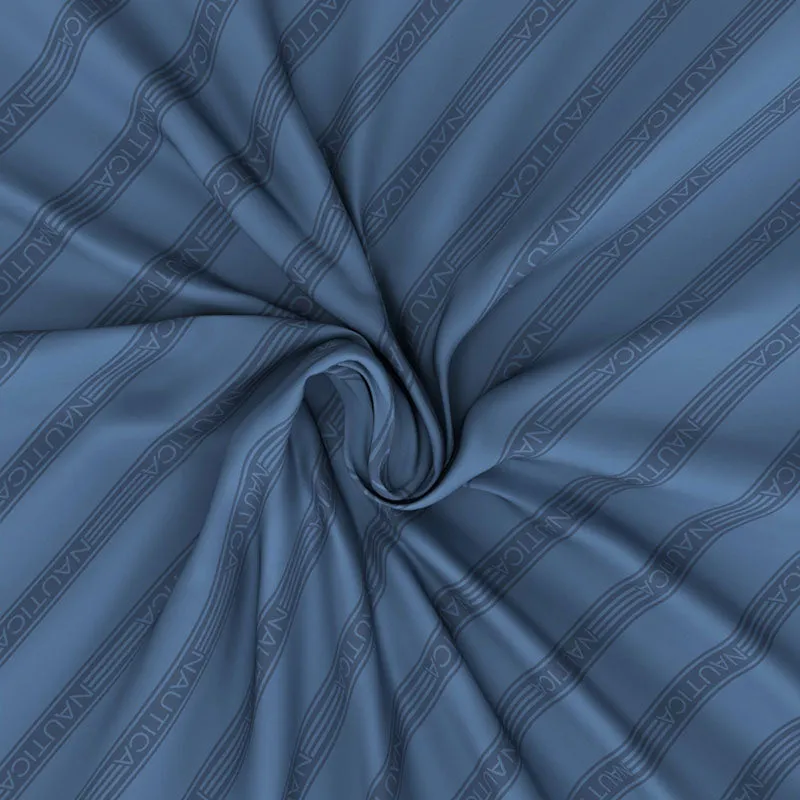 Navy blue striped bedsheet fabric gathered to show its soft drape