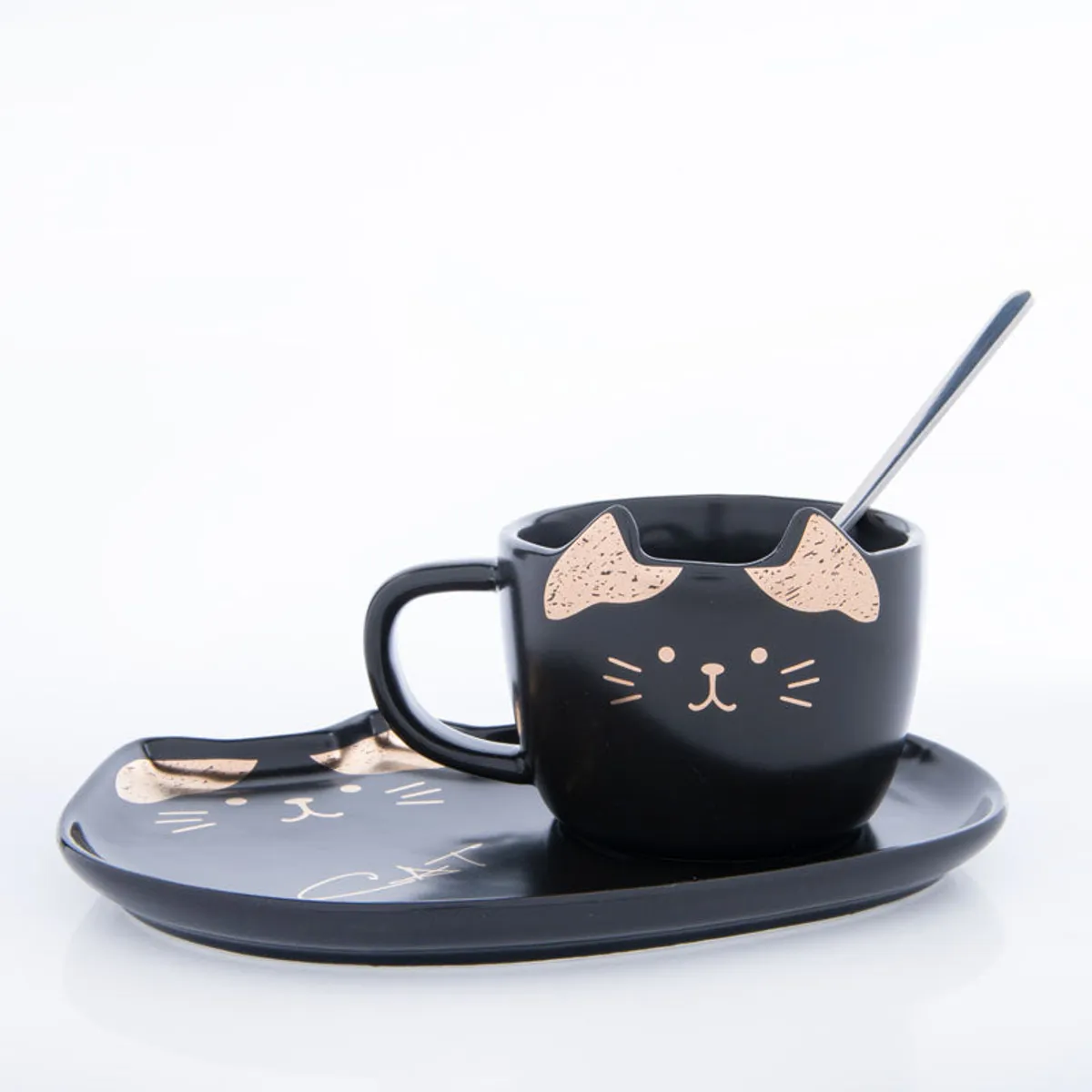 Black cat-themed mug with matching platter and spoon on a white background
