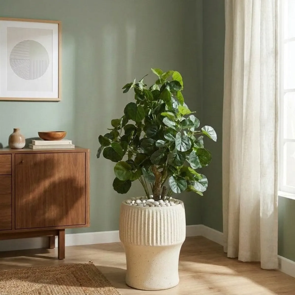 White ribbed floor planter holding a leafy indoor plant