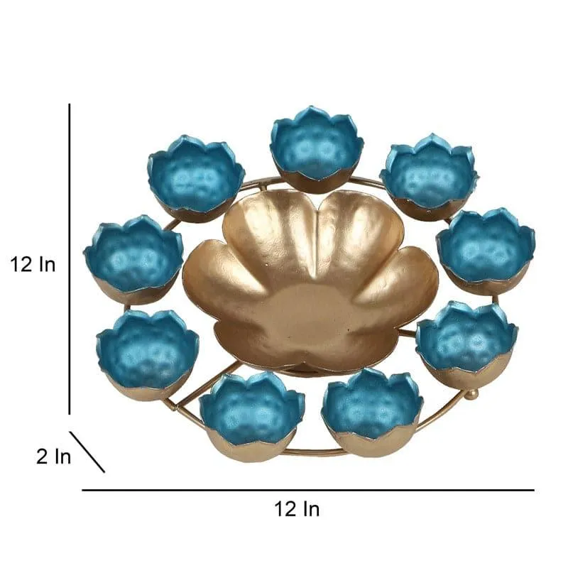 Top view of the blue and gold urli showing its circular floral arrangement