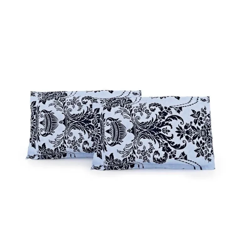 Two matching pillow covers in light blue with dark blue ethnic floral print