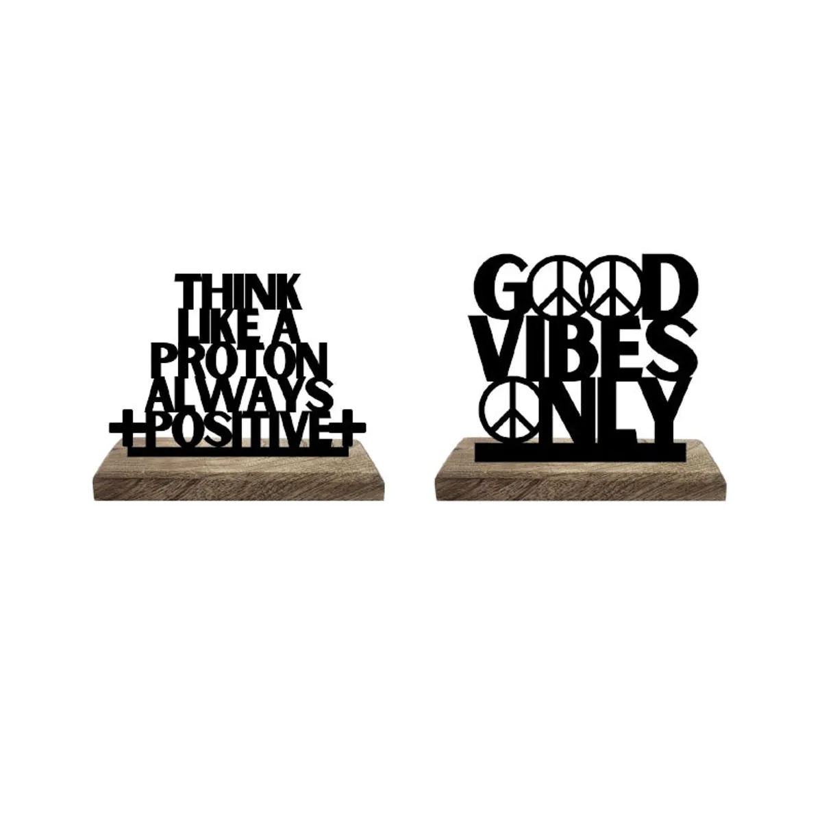 Two black typography showpieces on separate wooden bases against a white background