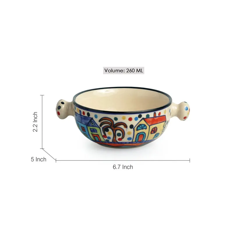 Two colourful ceramic bowls shown from the side, featuring illustrated houses and knob handles.