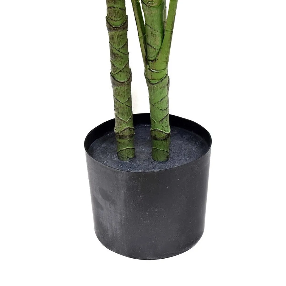 Close-up of green artificial plant stems emerging from a black plastic pot