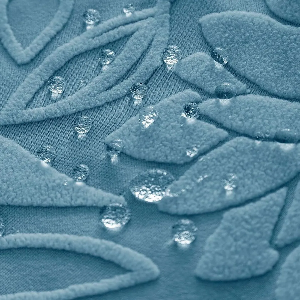 Close-up showing water droplets on the textured light blue chair cover