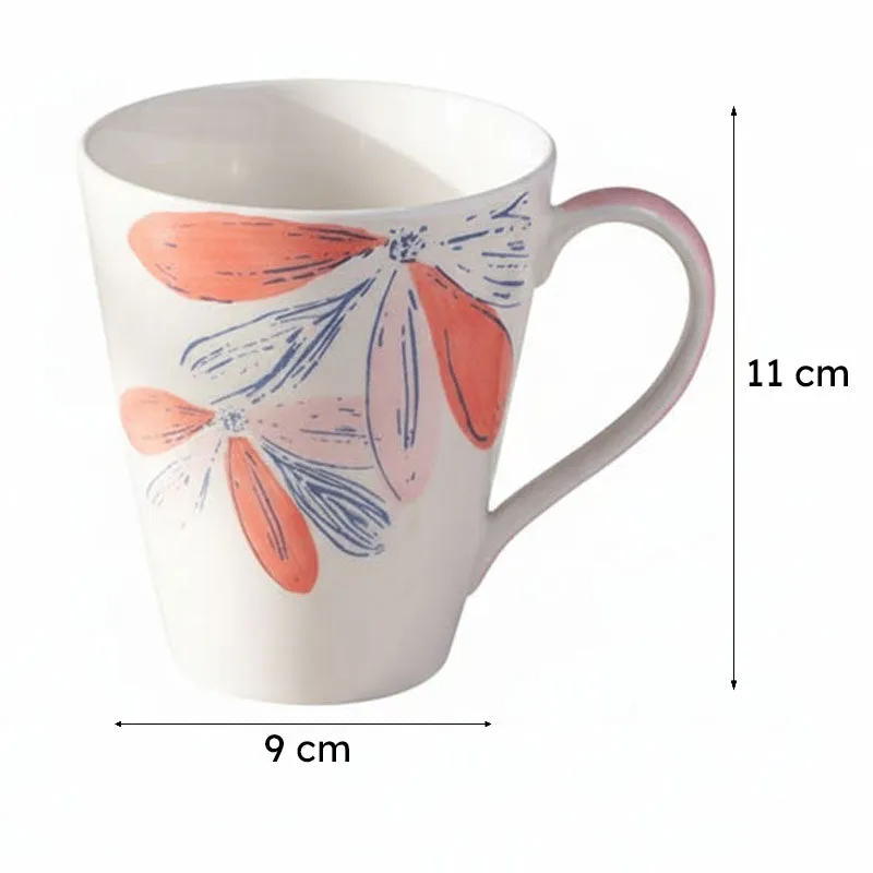 White floral mug shown with arrows indicating its 9 cm width and 11 cm height