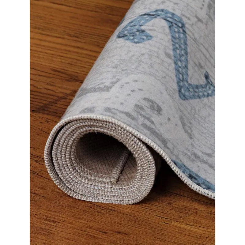 Rolled edge of the carpet showing the surface and backing