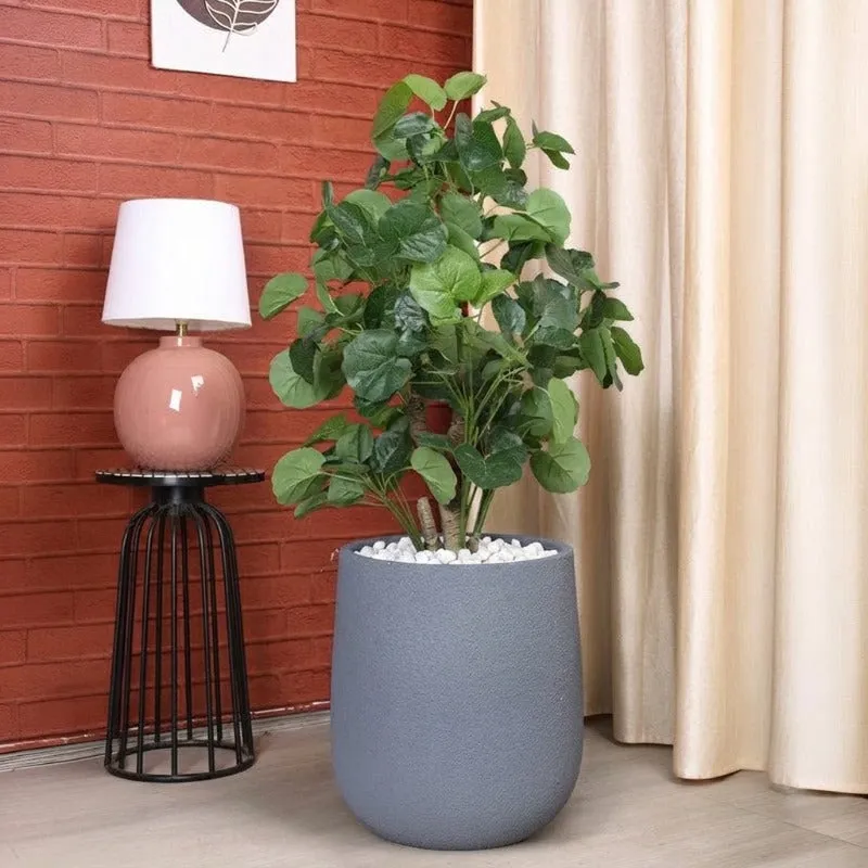 Close-up of the planter's coarse grey textured surface