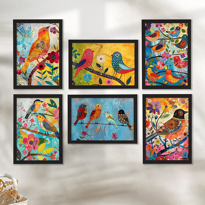 Six framed colourful bird artworks arranged in a gallery layout on a light wall.