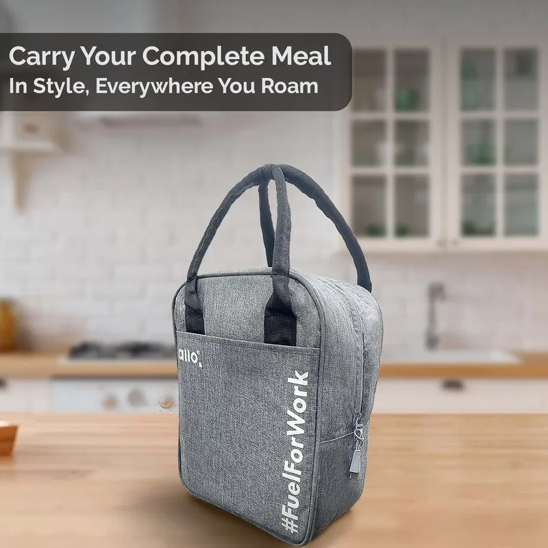 Grey lunch bag displayed on a kitchen counter with black handles