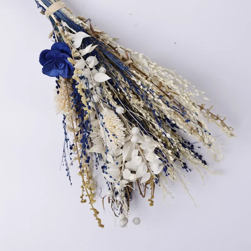 Close-up of the dried flower bunch with blue and ivory botanicals