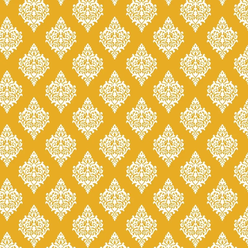 Close-up of the yellow and white ornamental cushion cover pattern