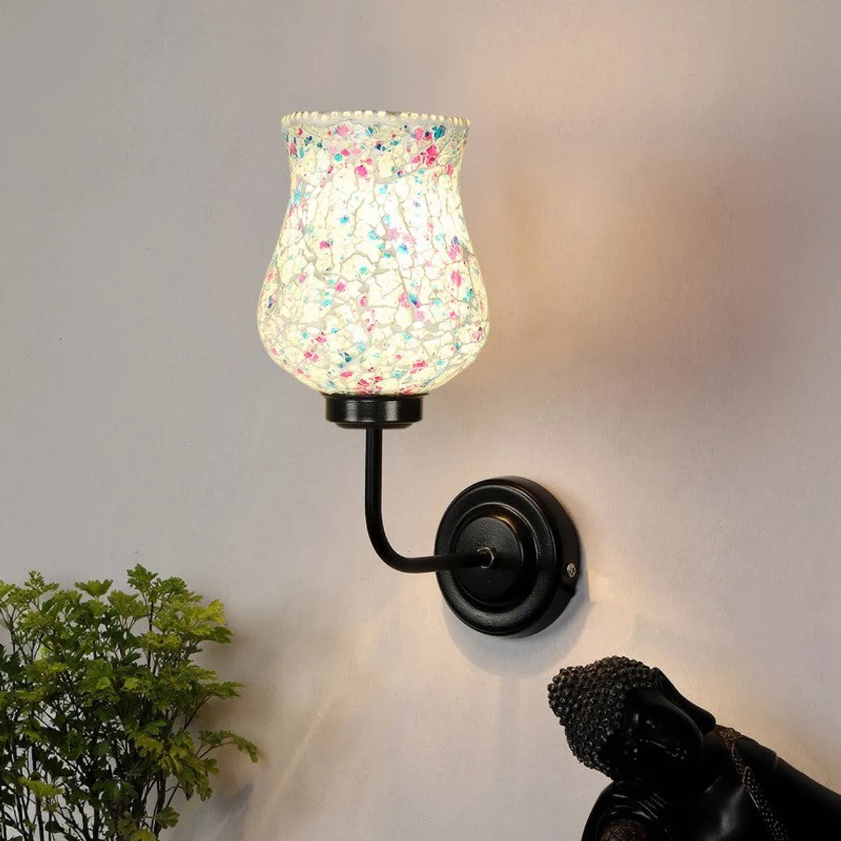 Single lit wall lamp with mosaic glass shade and black iron arm