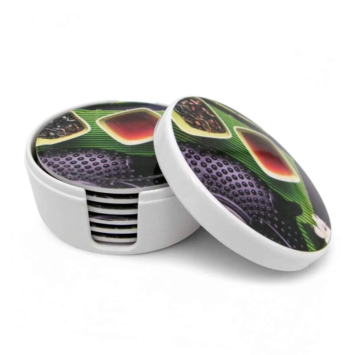 Close-up of stacked round coasters inside a white holder with one coaster leaning against it