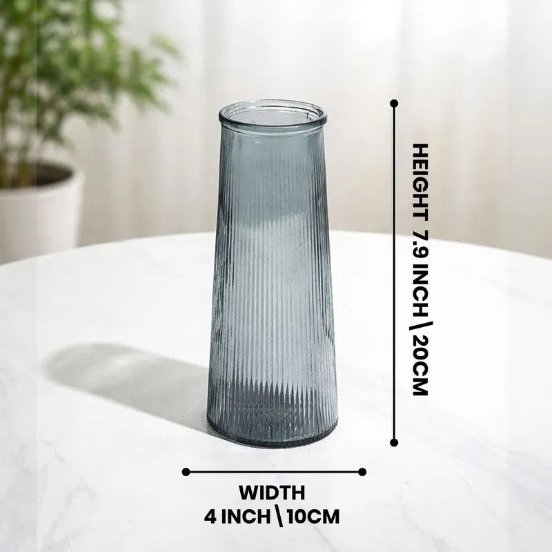 Grey fluted glass vase on a white table with size graphic
