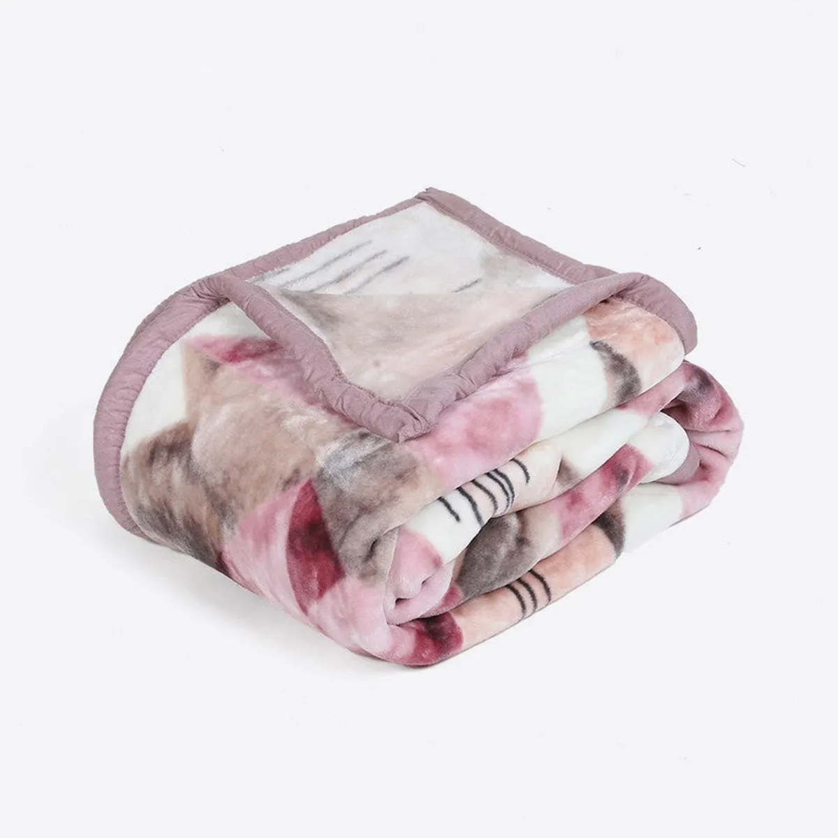 Folded pink and beige patterned blanket showing its plush surface