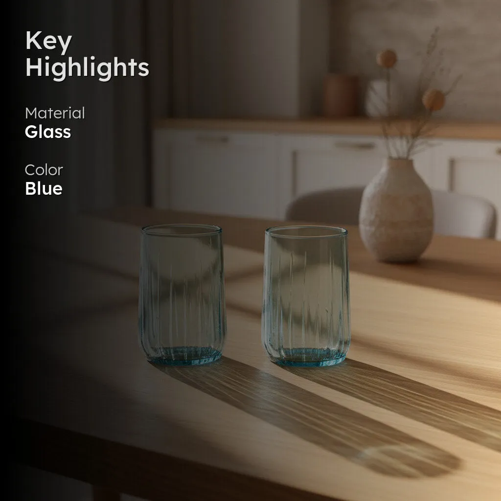 Two blue glass tumblers on a dining table with a key highlights overlay