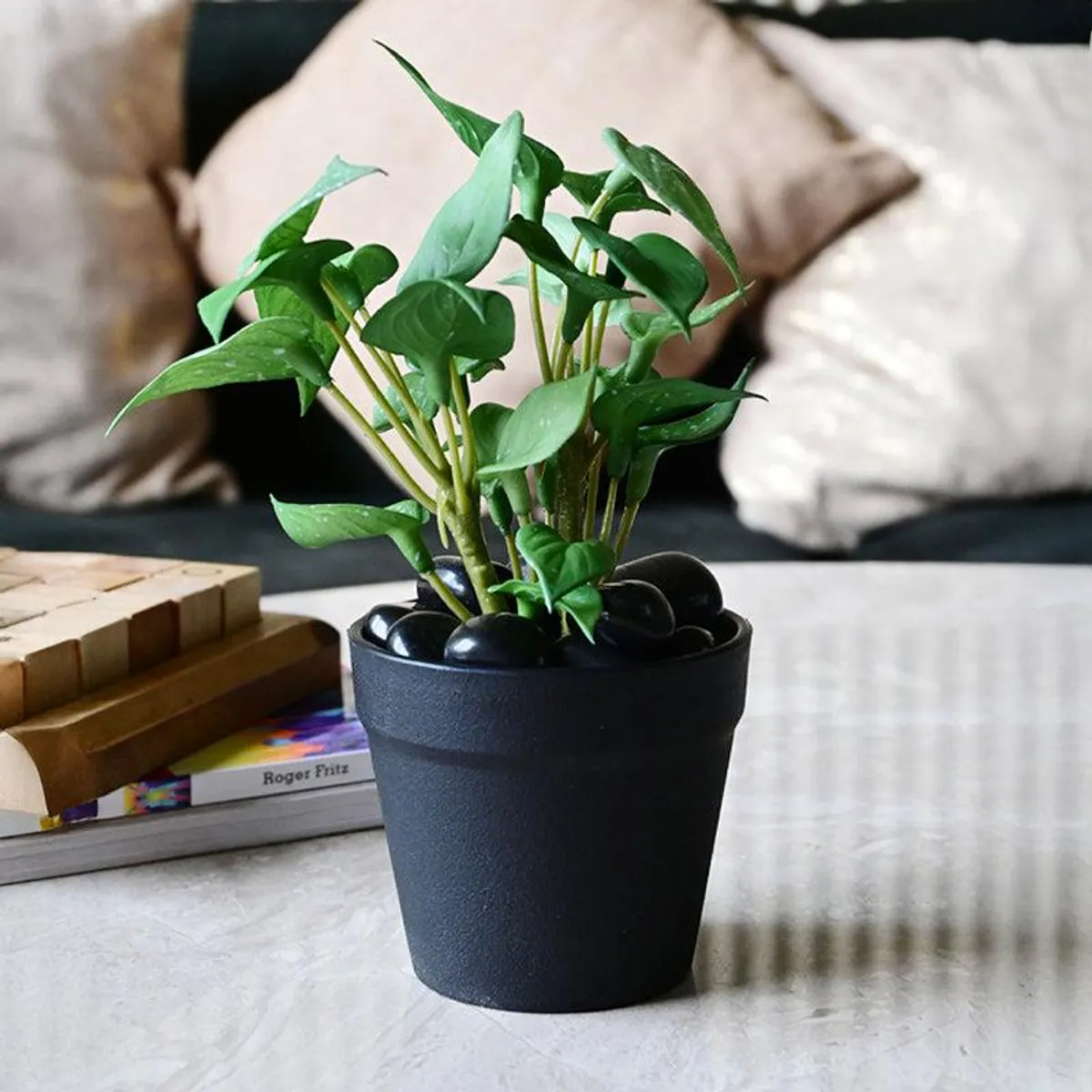 Potted artificial green plant styled on a living-room table