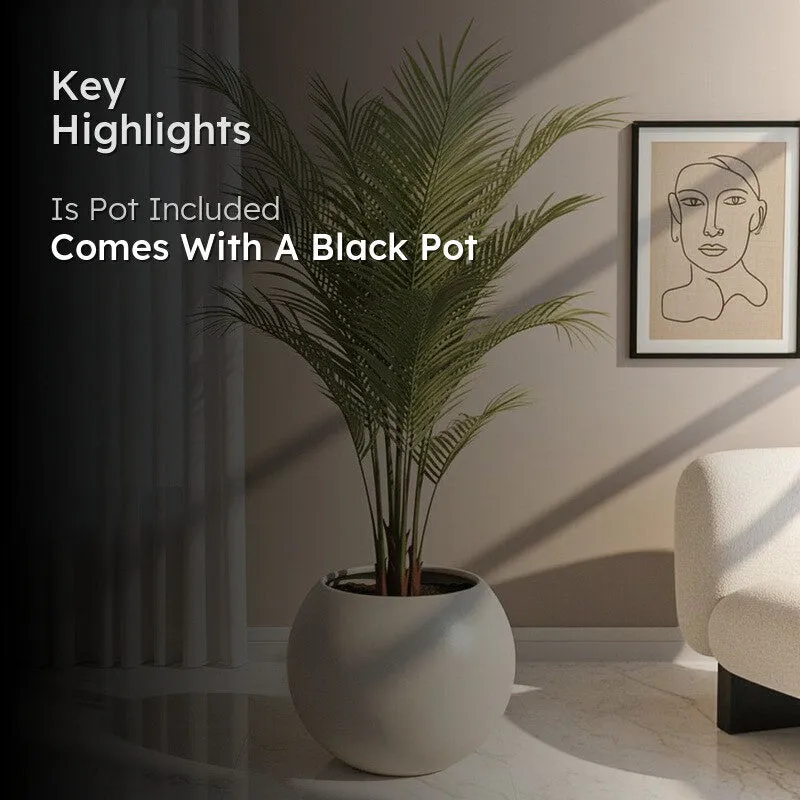 Faux areca palm styled in a living room with a black pot