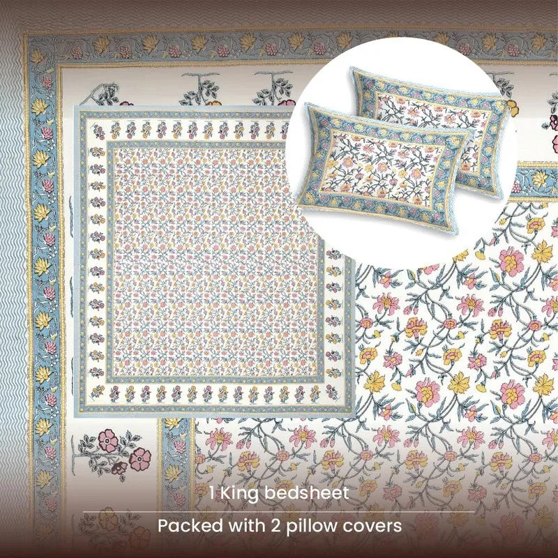 Top view of blue bordered floral bedsheet with two matching pillow covers