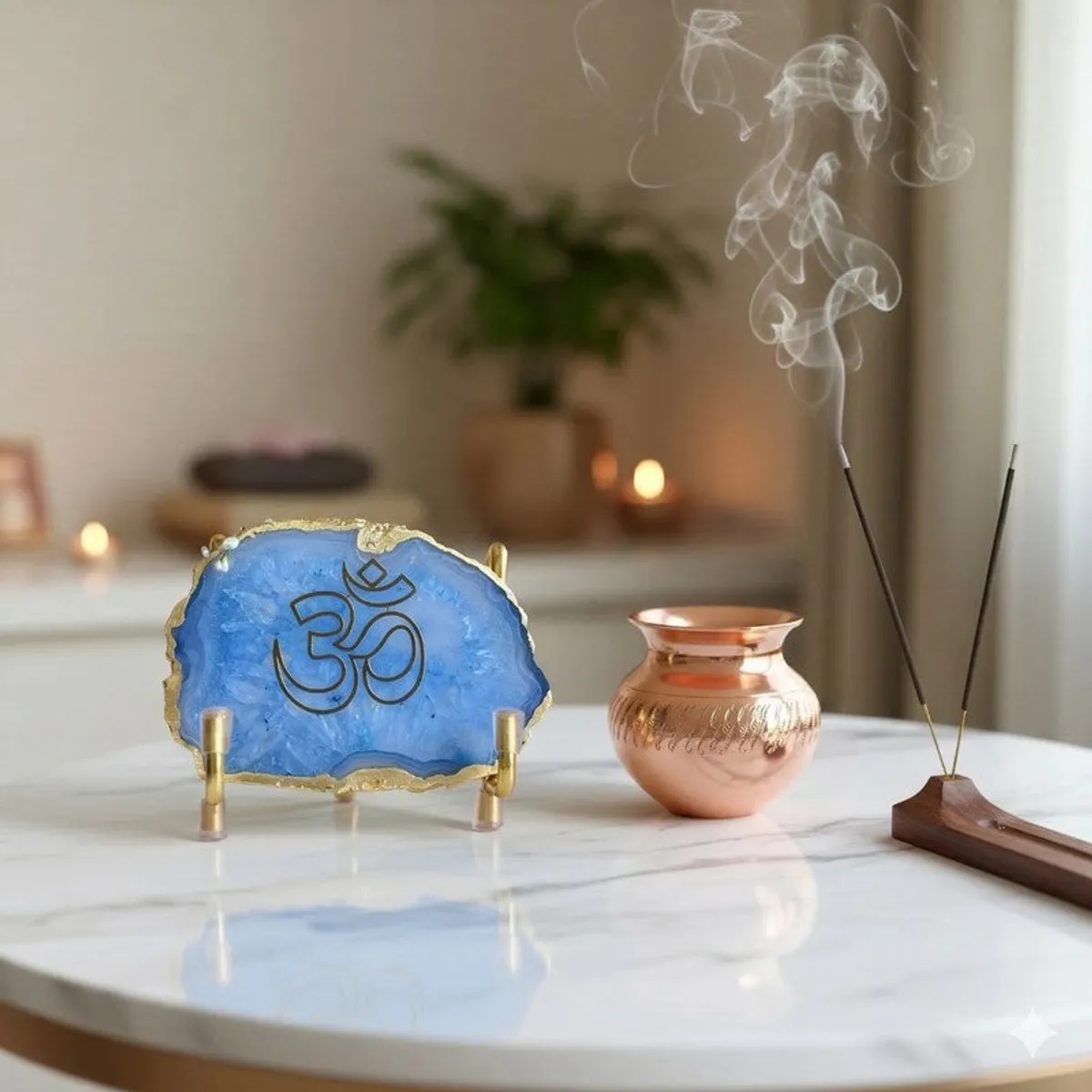 Blue Om agate accent styled on a marble table beside incense