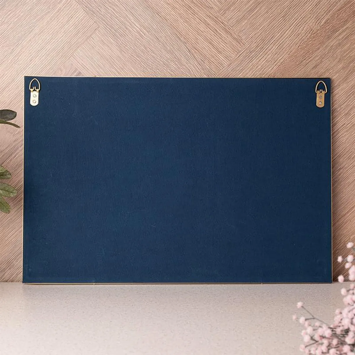 Back of the rectangular blue wall accent showing two wall-mount hangers.