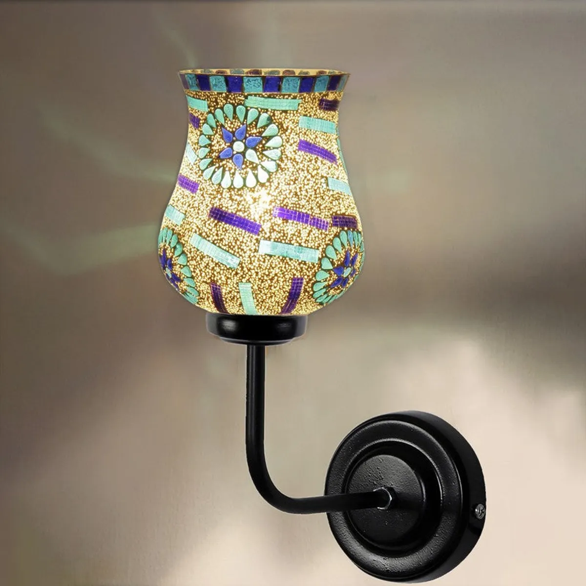 Lit tulip-shaped mosaic glass wall lamp with black iron mount