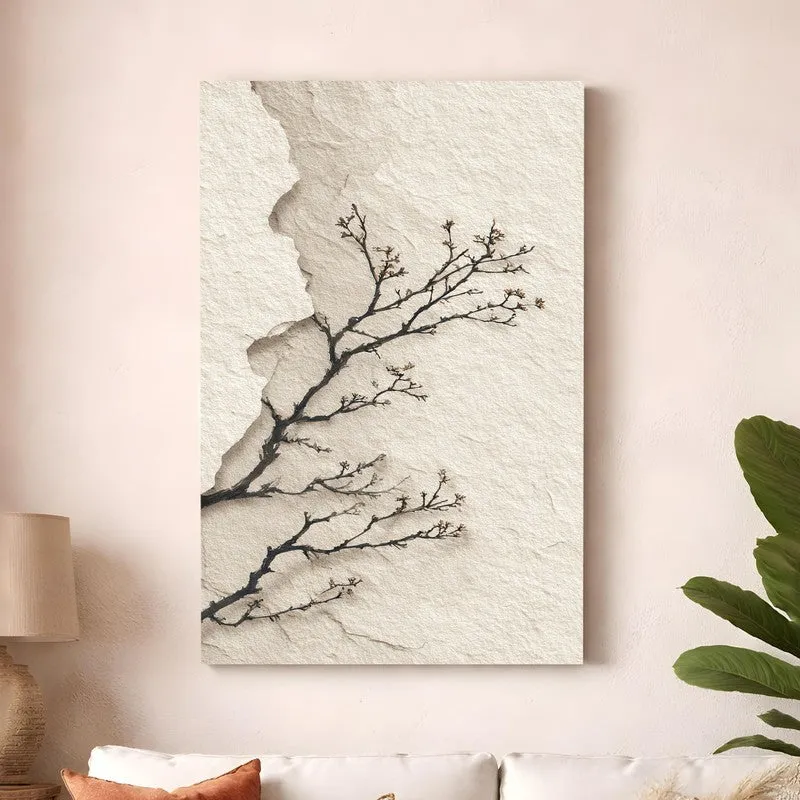 Canvas wall art with black branching motif on a textured beige background styled above a sofa