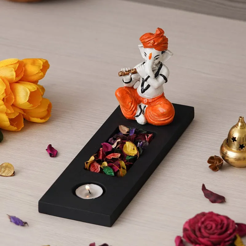 Table top tea light holder with seated Ganesha figurine on a black base