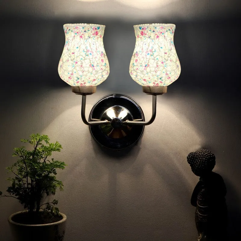 Glowing dual crackle glass wall lamp on a dark wall