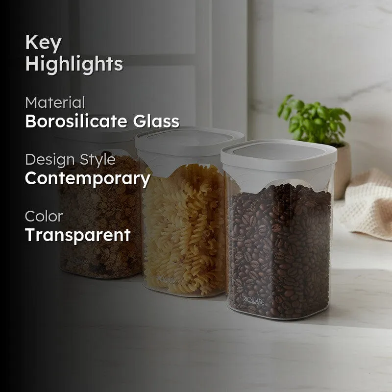 Three clear jars with white lids displayed in a contemporary kitchen setting.