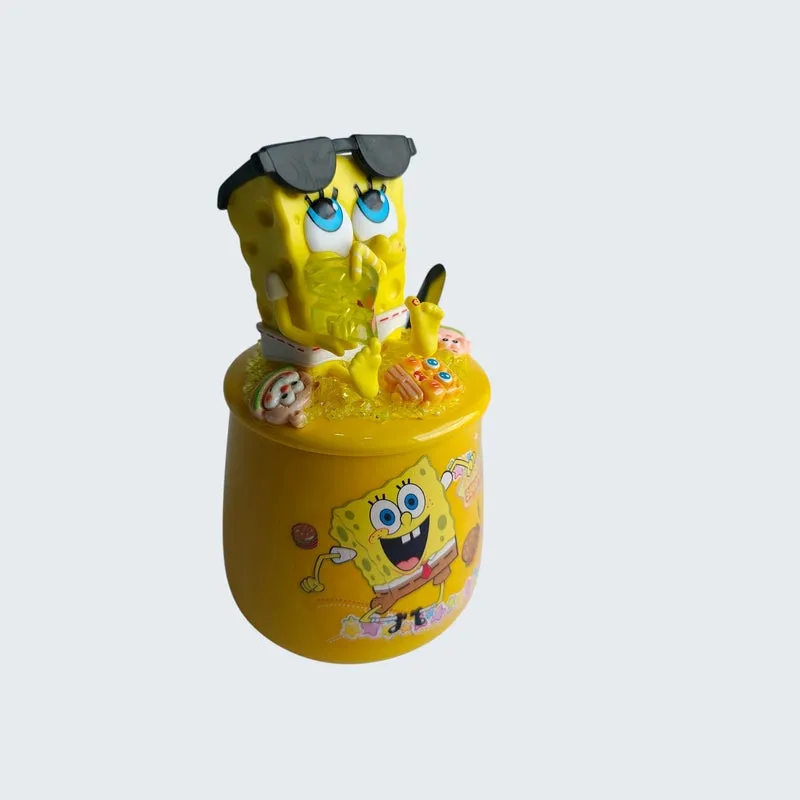 Angled view of yellow SpongeBob mug with detailed figurine lid