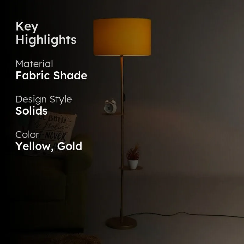 Yellow shade floor lamp with gold stand shown against a dark background with text overlay