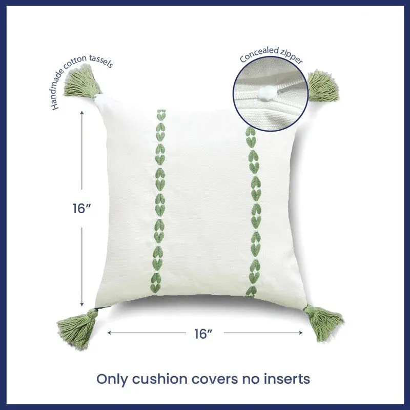 Single white cushion cover with green vertical motifs shown front on a plain background