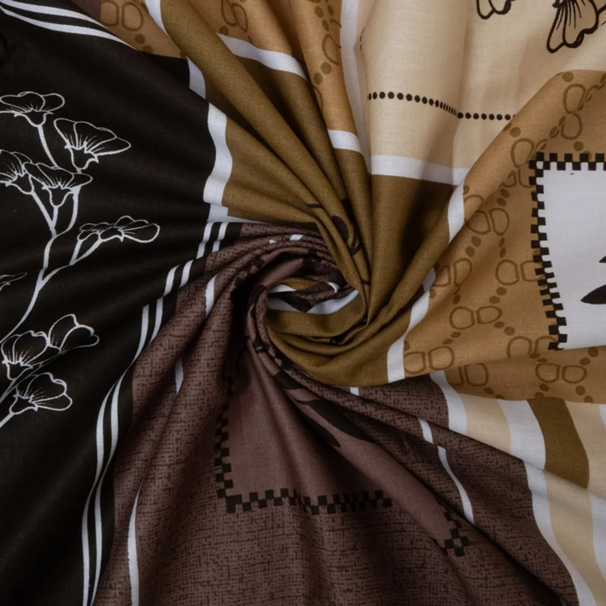 Close-up of beige, brown and black printed cotton bedsheet fabric