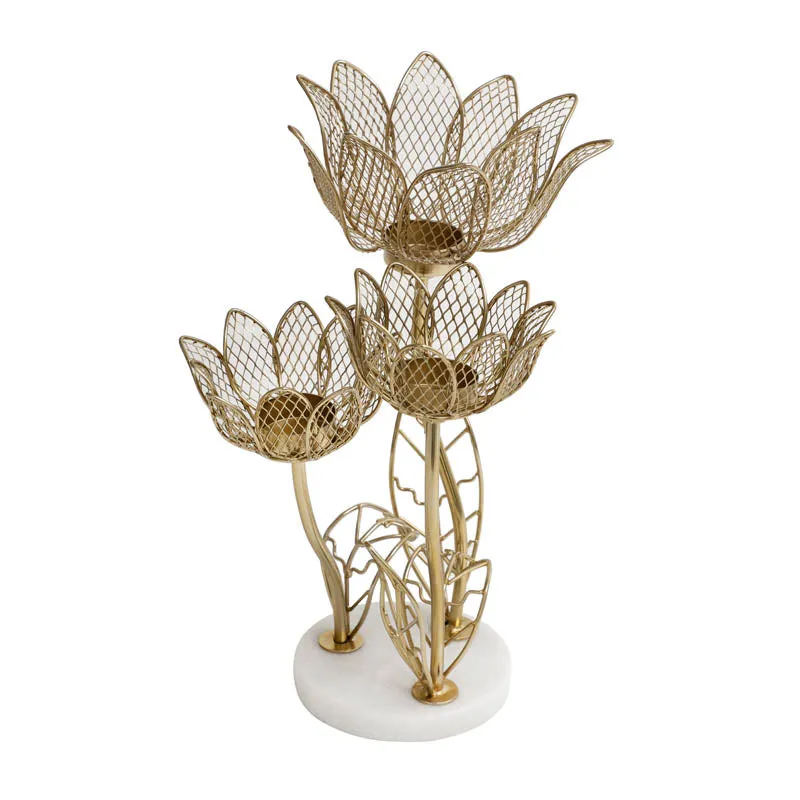 Front view of lotus-inspired triple candle holder with white round base