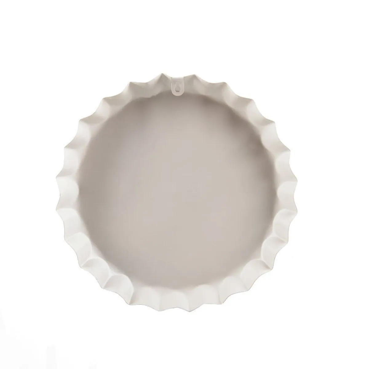 Back of a round bottle-cap-shaped wall accent showing its raised metal edge and hanging loop.