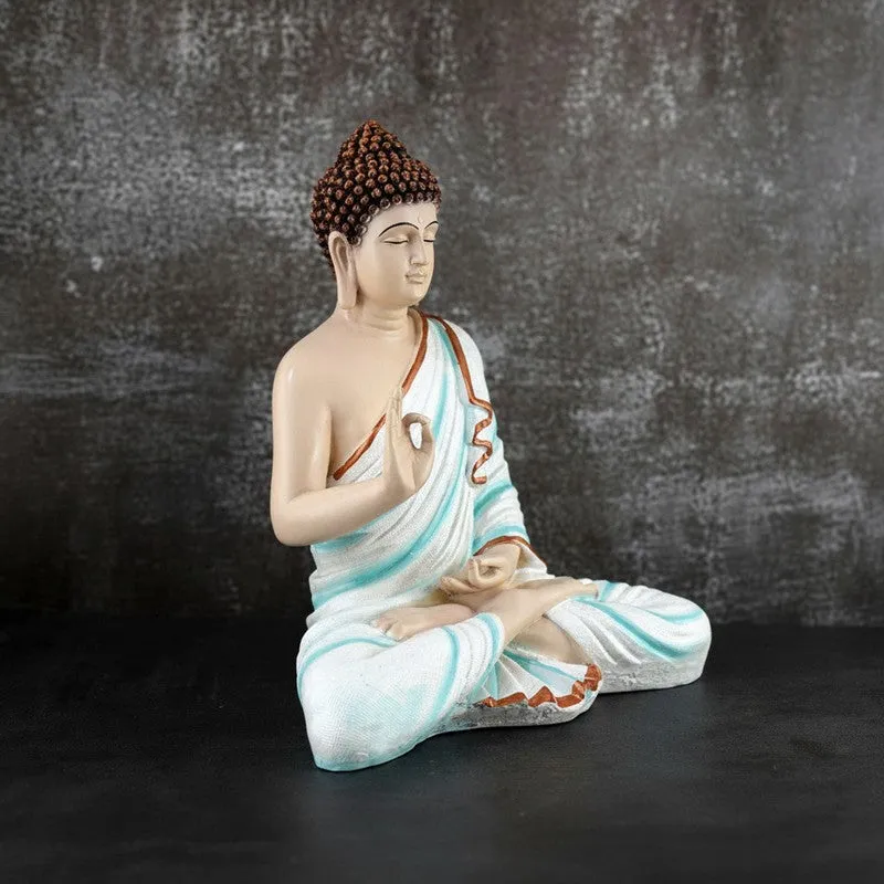 Angled view of seated Buddha showpiece with blue draped robe