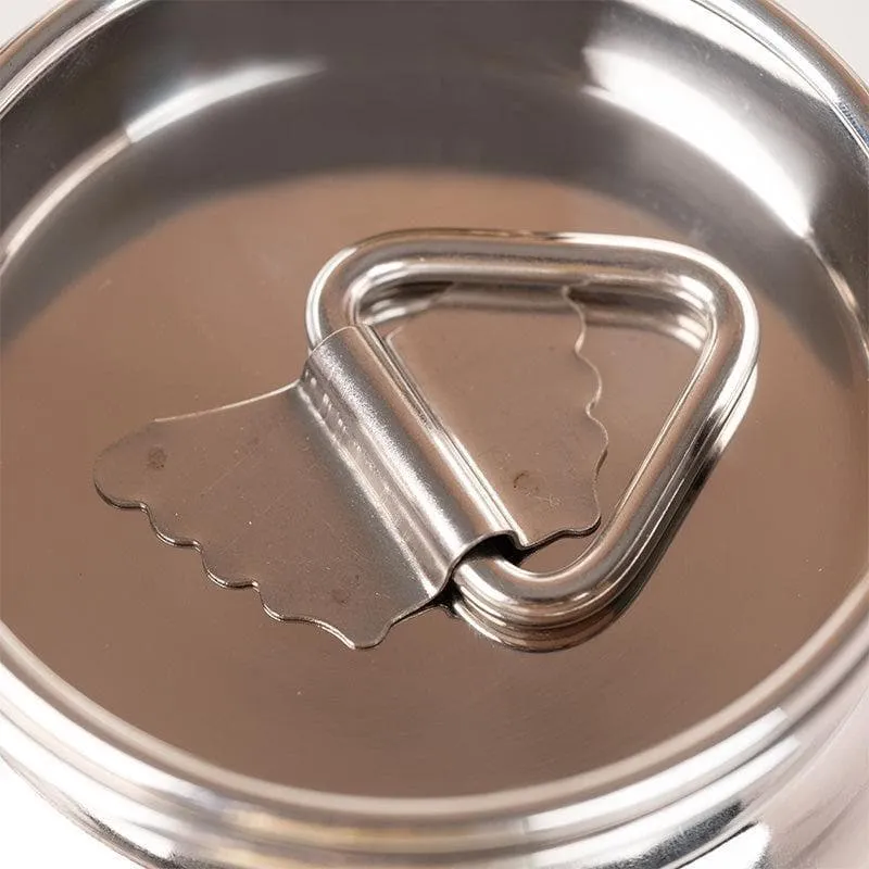 Close-up of the triangular handle on the silver container lid