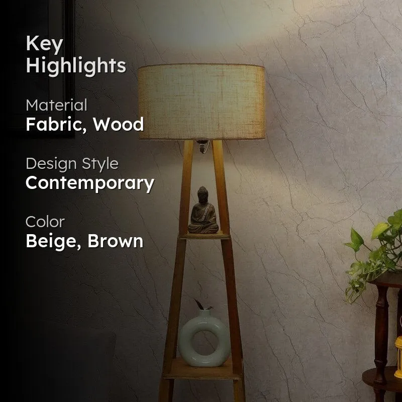 Wooden floor lamp with beige shade in a styled interior setting