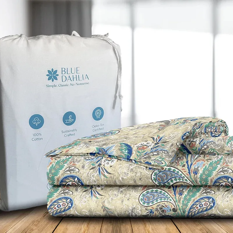 Folded paisley duvet cover beside its white storage bag