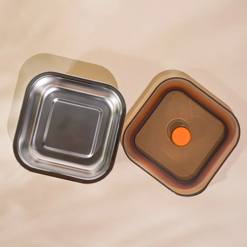 Top view of the stainless steel container base beside its dark lid