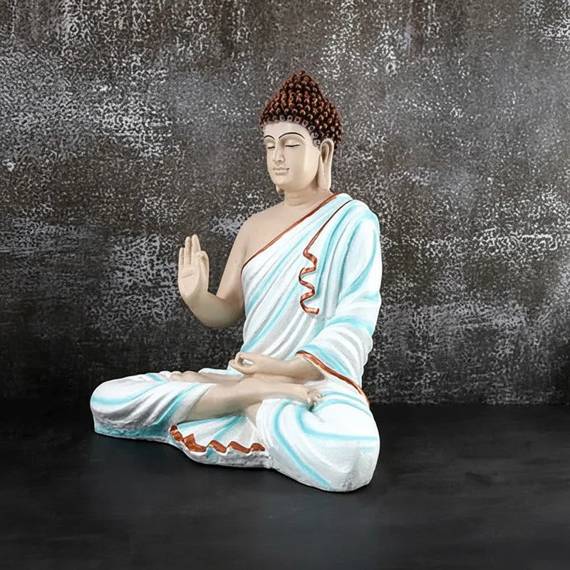 Three-quarter view of Buddha marble showpiece in meditation pose